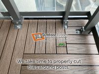 We take our time cutting composite tiles on a balcony