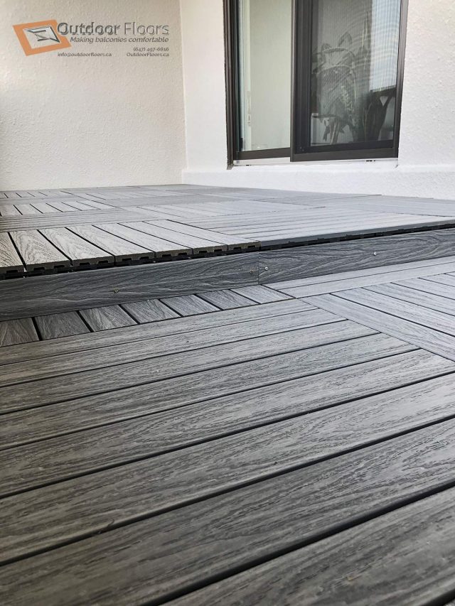 Composite deck tile's cap resembles real wood with its embossing.