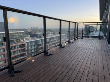 IPE 1x2 WPC deck tiles installed in a linear pattern on an open condo balcony in Vaughan, featuring built-in deck lights